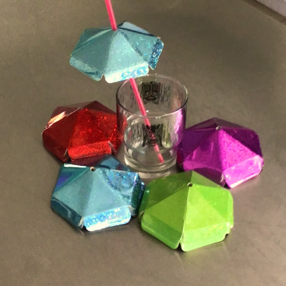 39 Sparkling  drink umbrellas. 10 of each colors (except green 1 missing)